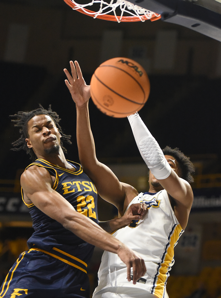 Staff photo by Matt Hamilton/ ETSU (22) Jayden Seymour collides with UTC (4) Sam Alexis as they battle for the ball during their game at McKenzie Arena on Wednesday, February 14, 2024.