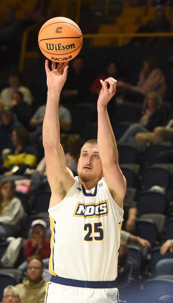Staff photo by Matt Hamilton/ UTC (25) Jan Zidek puts up a three during their game against ETSU at McKenzie Arena on Wednesday, February 14, 2024.