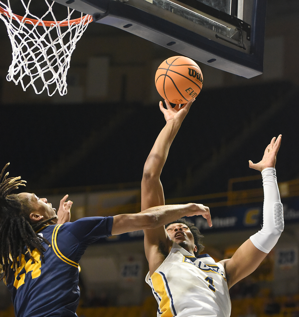 Staff photo by Matt Hamilton/ ETSU (24) Jadyn Parker defends as UTC (4) Sam Alexis puts up a shot during their game at McKenzie Arena on Wednesday, February 14, 2024.