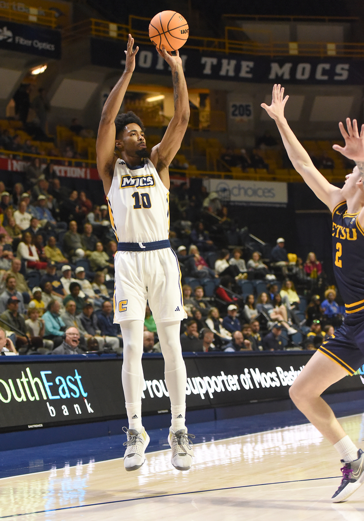Staff photo by Matt Hamilton/ ETSU (2) Maki Johnson defends as UTC (10) Tyler Millin puts up a shot during their game at McKenzie Arena on Wednesday, February 14, 2024.