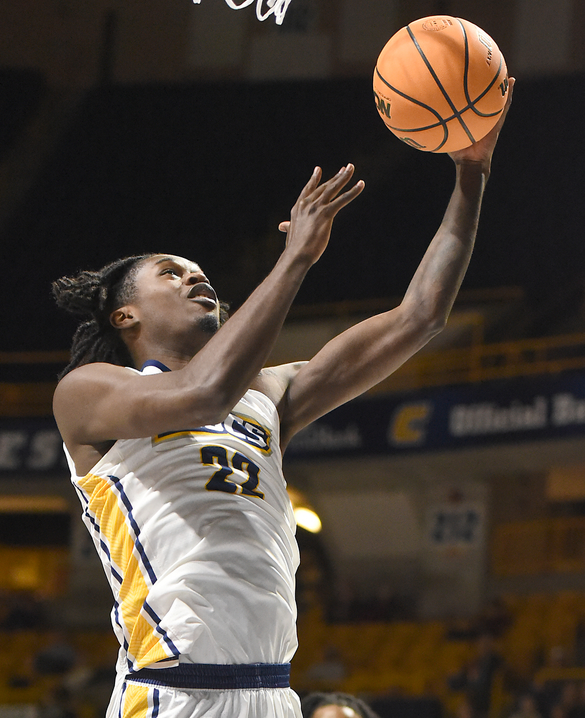 Staff photo by Matt Hamilton/ UTC (22) Demetrius Davis glides to the hoop during their game against ETSU at McKenzie Arena on Wednesday, February 14, 2024.