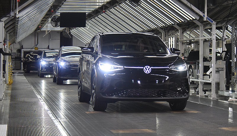 Staff photo by Matt Hamilton / Vehicles come off the Volkswagen Chattanooga assembly line during the launch celebration for the initial ID.4 electric SUVs made at the plant in 2022.