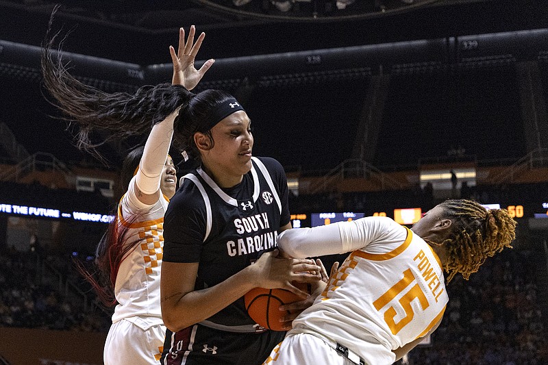 AP photo by Wade Payne / South Carolina center Kamilla Cardoso, center, battles for the ball with Tennessee guard Jasmine Powell during an SEC matchup Thursday night in Knoxville. Cardoso, now a standout for the nation's top-ranked women's college basketball team, was a prep star at Chattanooga's Hamilton Heights Christian Academy.