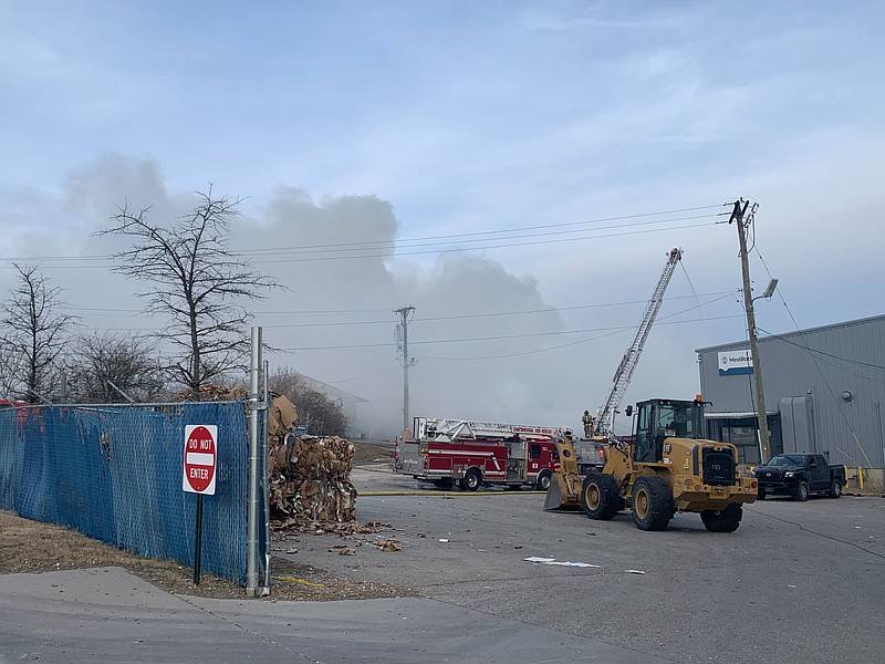 Staff photo by Ellen Gerst / Stacked boxes caught fire at Chattanooga's WestRock recycling facility off Market Street on Friday, sending thick smoke into downtown.