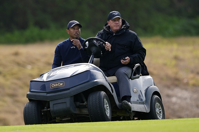 AP photo by Ryan Sun / Tiger Woods is driven off the course after withdrawing during the second round of the PGA Tour's Genesis Invitational on Friday at Riviera Country Club in Los Angeles.