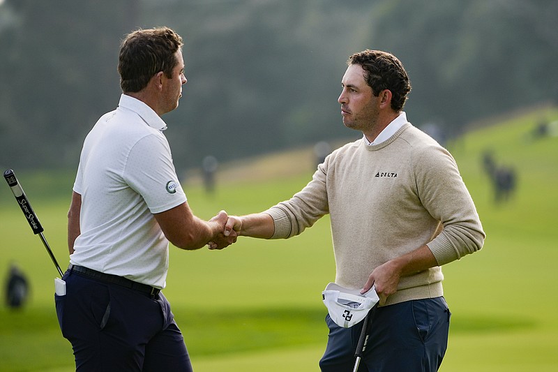 AP photo by Ryan Sun / Luke List, left, shakes hands with Patrick Cantlay on the 18th green at Riviera Country Club during the third round of the PGA Tour's Genesis Invitational on Saturday in Los Angeles.