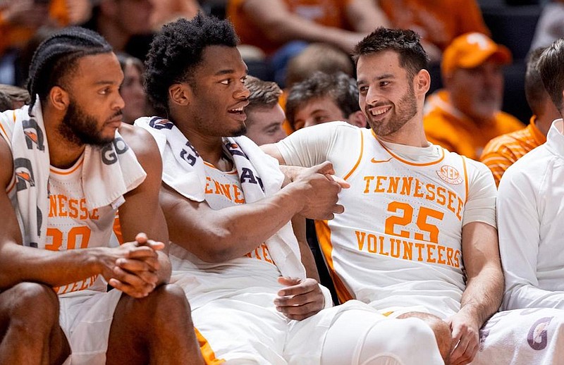 Tennessee Athletics photo / From left, Tennessee's Josiah-Jordan James, Tobe Awaka and Santiago Vescovi relax on the bench during the waning moments of Saturday night's 88-53 plastering of Vanderbilt.