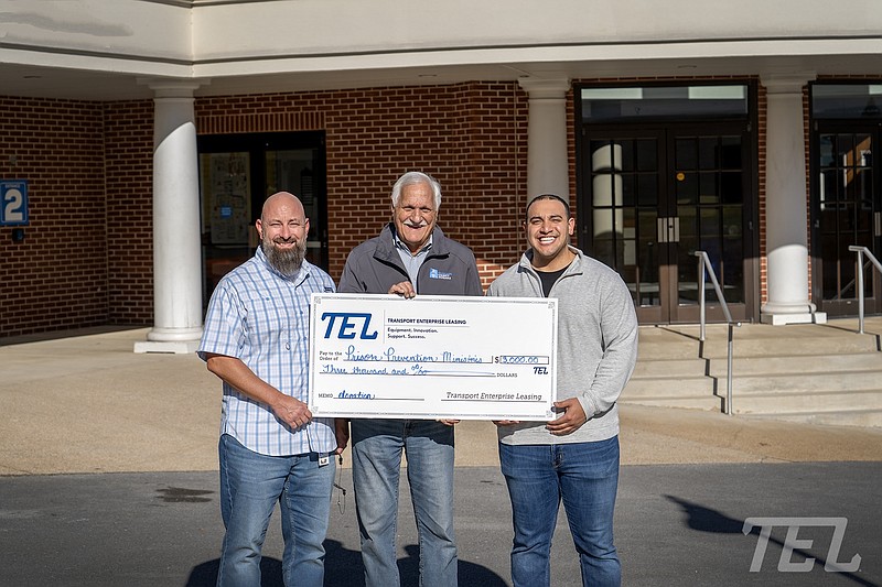 Contributed photo / At the check presentation, from left, are Nathan Stokes of TEL, Joe Smith of Prison Prevention Ministries and Brian Broome of TEL.