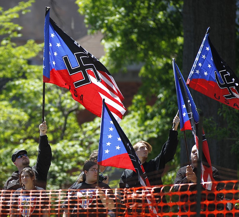Staff file photo / About two dozen members of the neo-Nazi National Socialist Movement group hold a rally on Saturday, April 26, 2014, on the lawn of the Hamilton County Courthouse in Chattanooga.