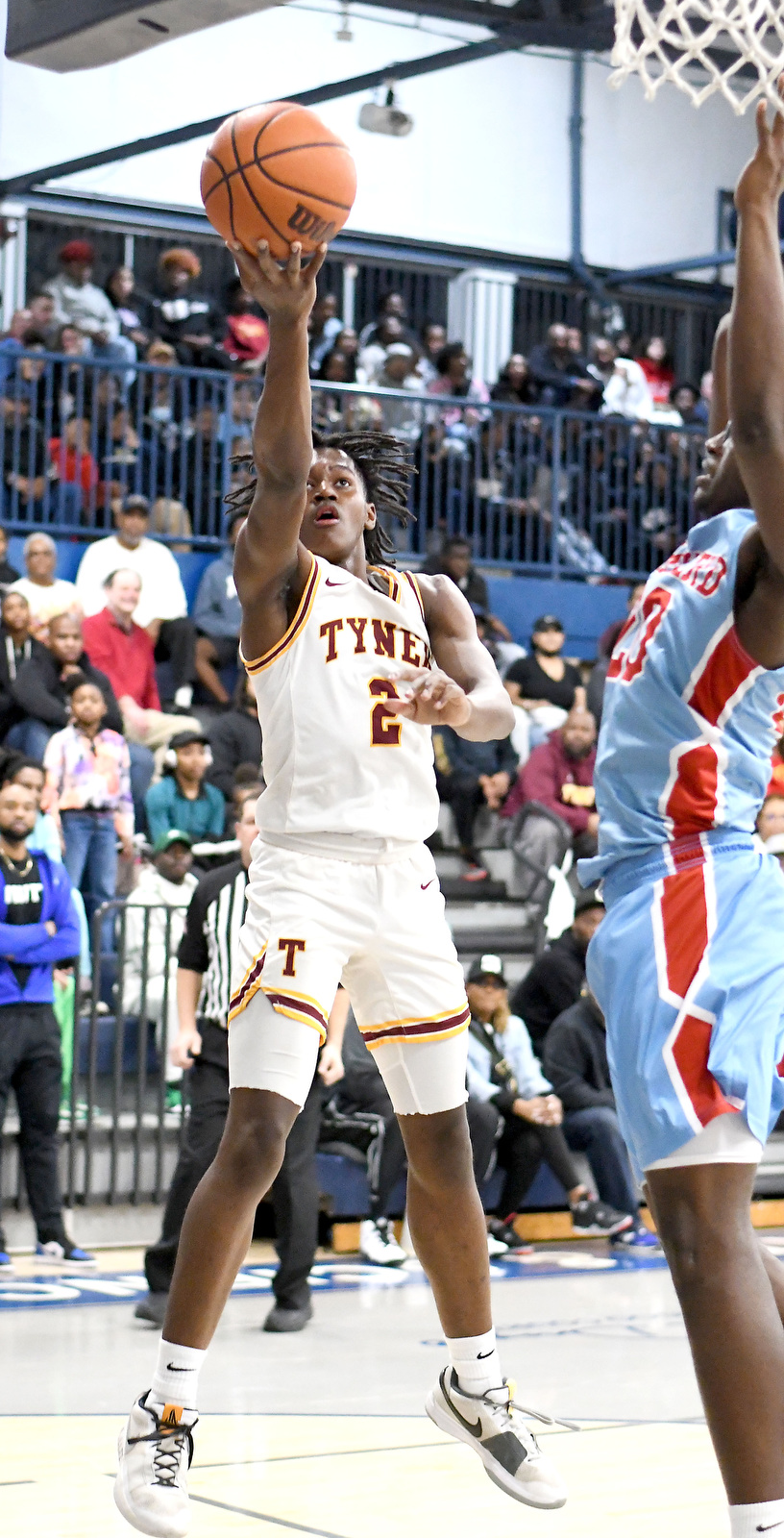 Staff Photo by Robin Rudd / Tyner's Rodney Henderson (2) scores on a layoup. The Brainerd Panthers met the Tyner Rams in the District 4-AA tournament championship, played at Chattanooga School for Arts and Sciences, on February 20, 2024.