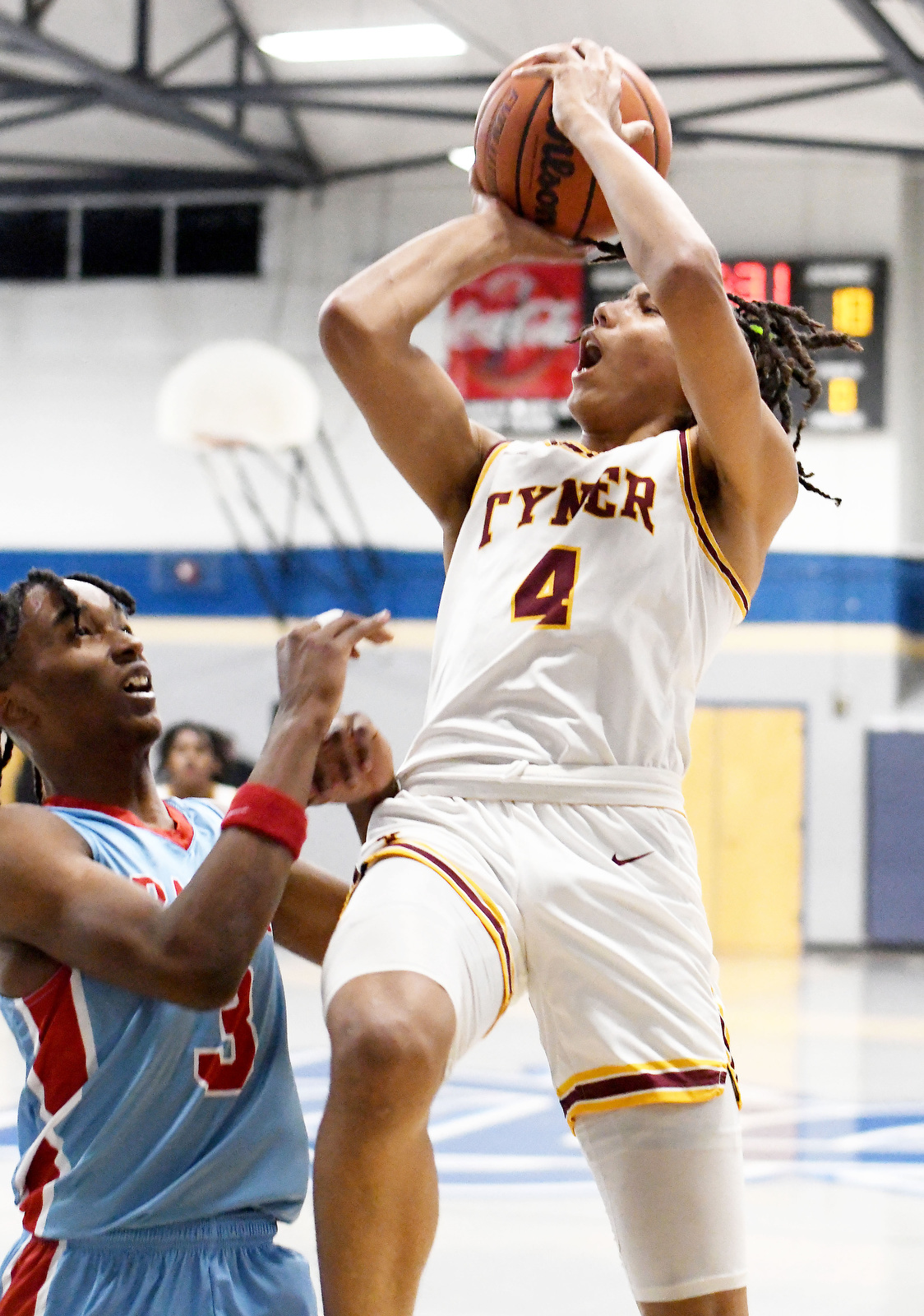 Staff Photo by Robin Rudd / Tyner's Zion Pinkerston drives to the basket during the Rams' blowout win over Brainerd in Tuesday's District 4-AA championship at Arts & Sciences.