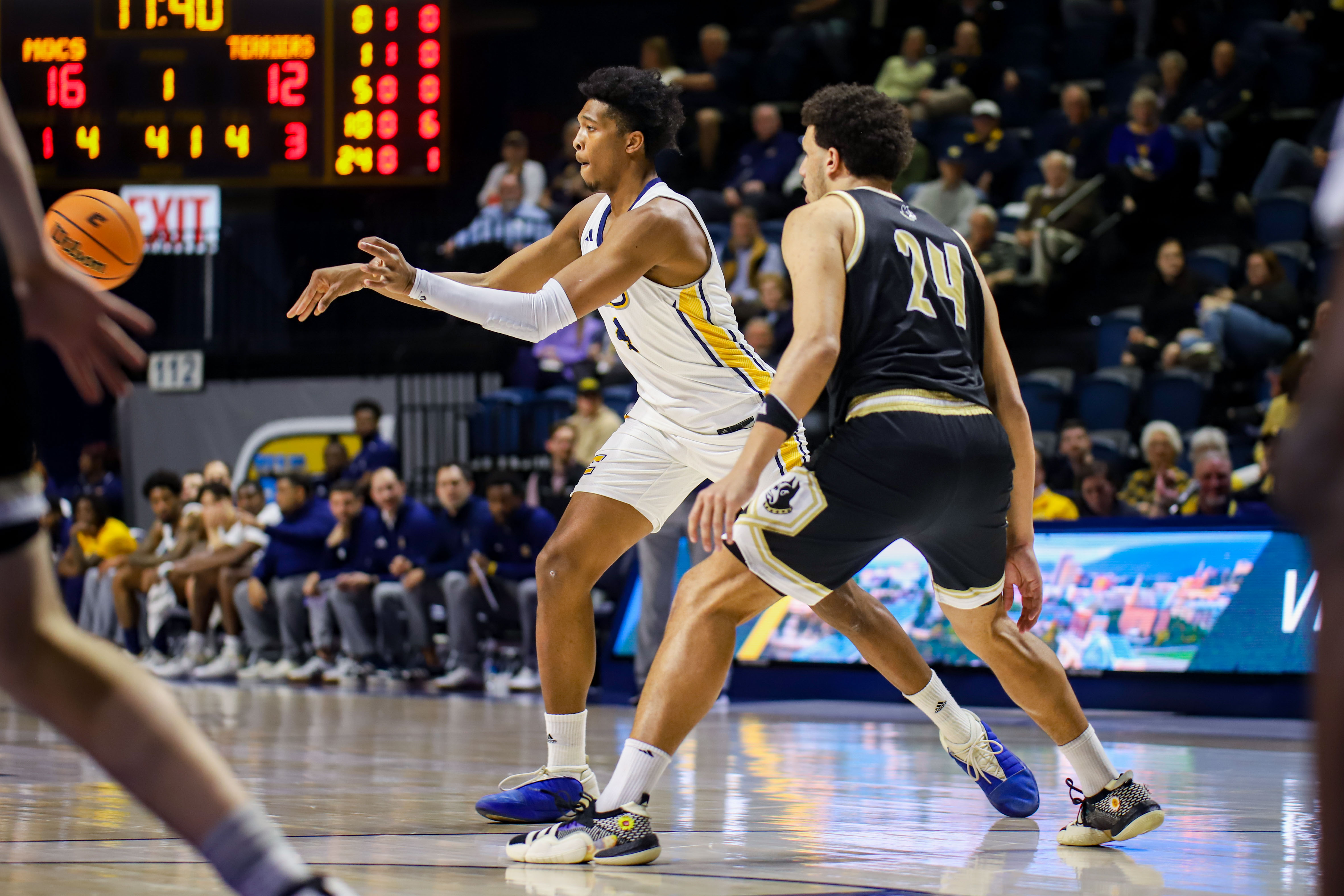 Staff photo by Olivia Ross / UTC's Sam Alexis (4) passes the ball. UT Chattanooga took on Wofford at home on Wednesday, February 21, 2024.