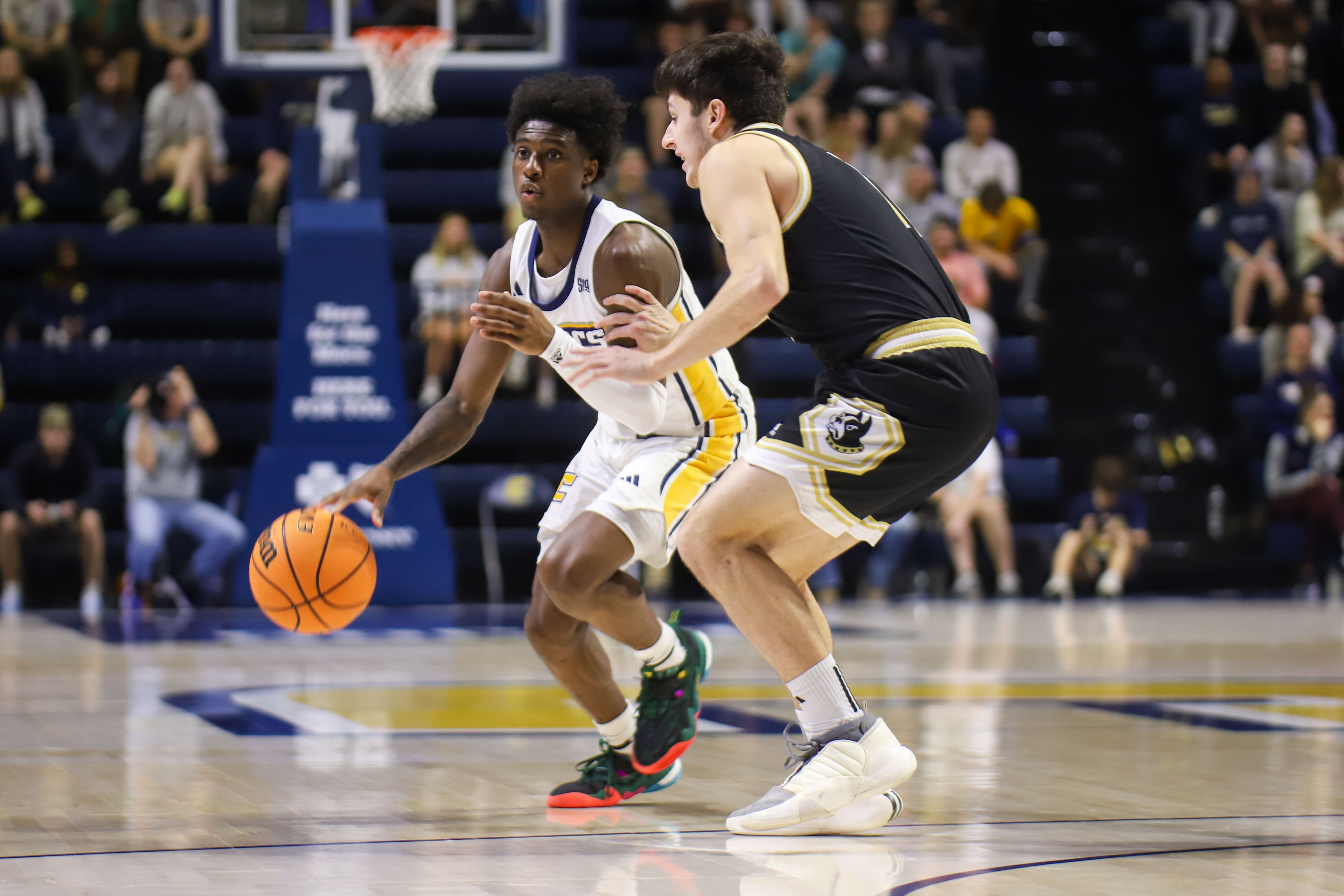 Staff photo by Olivia Ross / UTC's Honor Huff dribbles while guarded by Wofford's Quentin Meza during Wednesday night's SoCon game at McKenzie Arena. Huff made five 3-pointers in a 29-point performance to help the Mocs pull away from the Terriers in the second half for an 81-65 win.