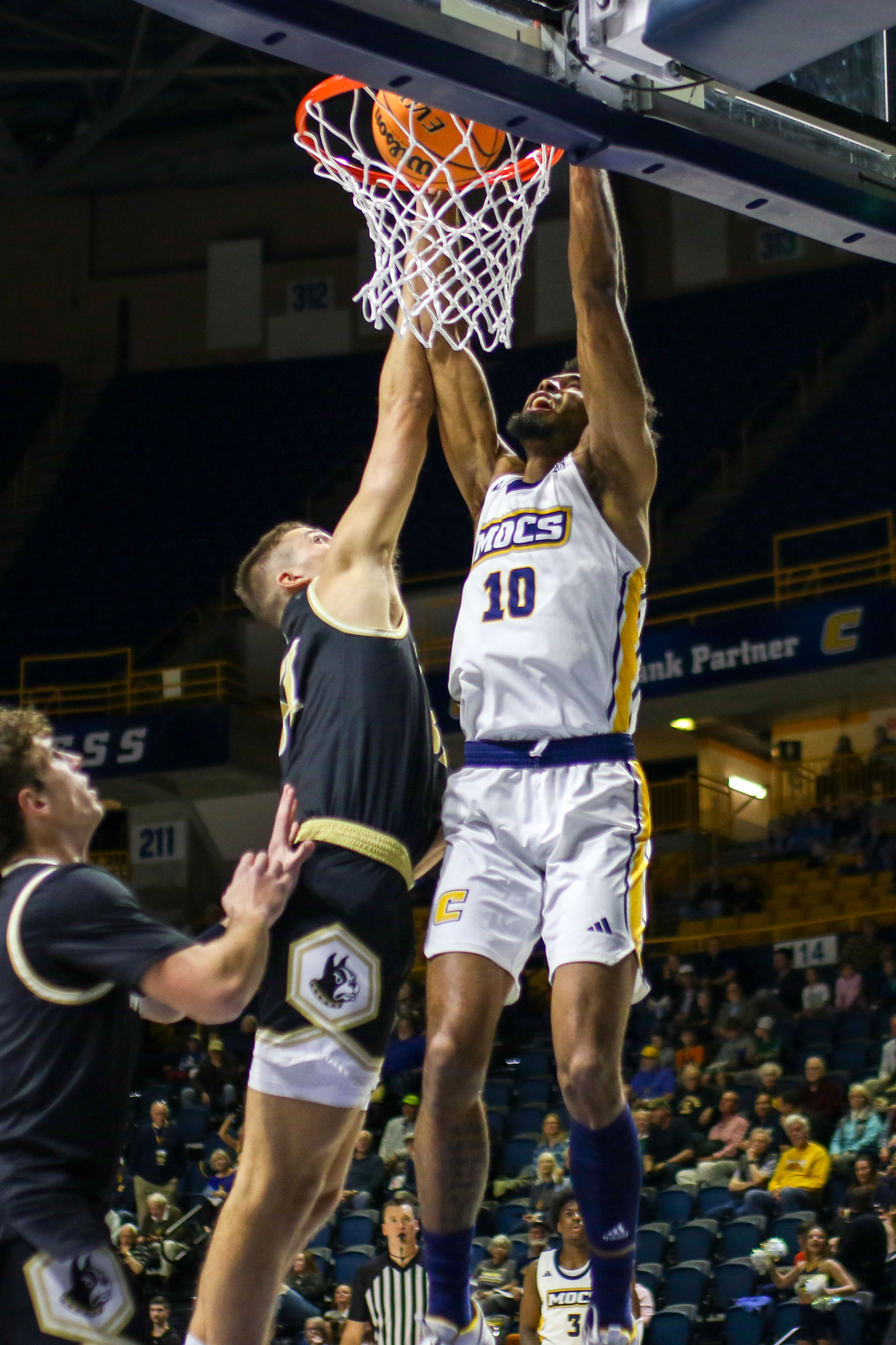 Staff photo by Olivia Ross / UTC's Tyler Millin (10) dunks. UT Chattanooga took on Wofford at home on Wednesday, February 21, 2024.
