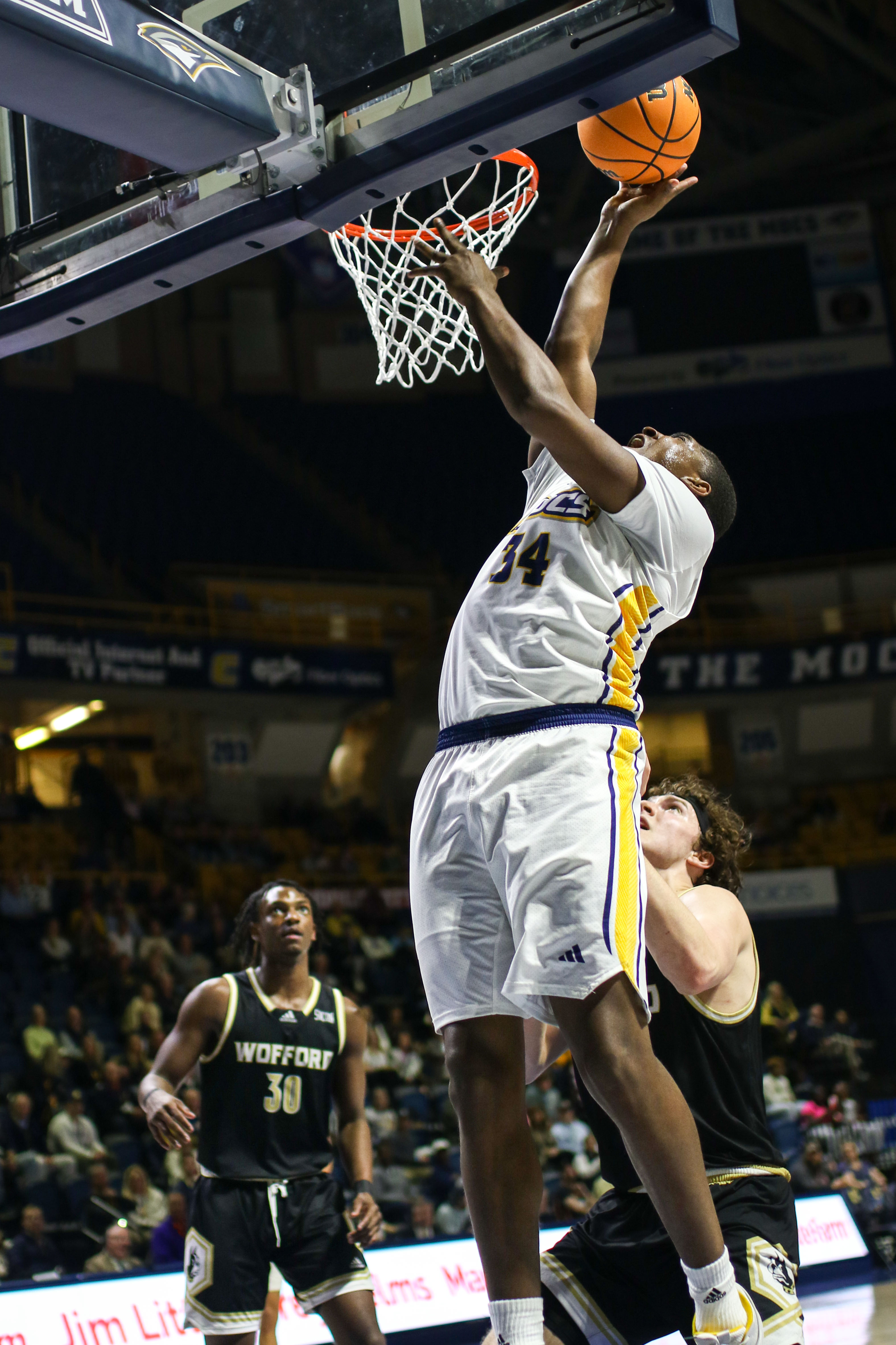 Staff photo by Olivia Ross / UTC's Randy Brady (34) shoots. UT Chattanooga took on Wofford at home on Wednesday, February 21, 2024.