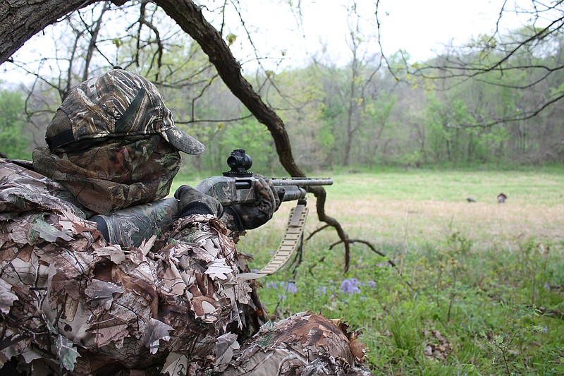 Contributed photo / Dave Miller lines up his shot while turkey hunting. It may still be winter, but the spring turkey hunters are already itching to get out into the field and call in some gobblers, writes "Guns & Cornbread" columnist Larry Case.