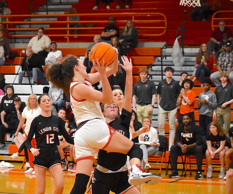 Staff photo by Patrick MacCoon / Signal Mountain senior Ashlyn Rock, driving, helped lead the charge in Monday's Region 3-AAA semifinals victory over Lenoir City at East Ridge High School.