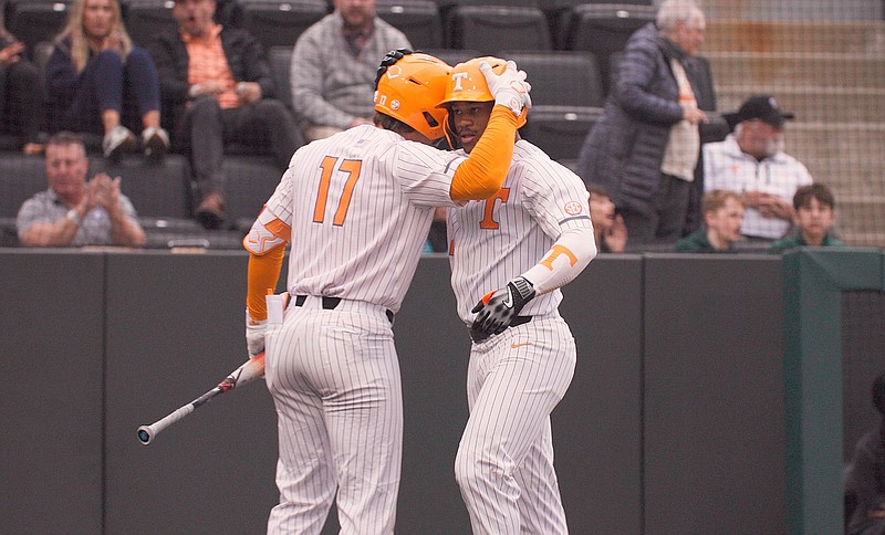 Tennessee Athletics photo / Tennessee's Robin Villeneuve (17) congratulates Kavares Tears following a solo home run by Tears during Tuesday's 7-4 win over High Point.