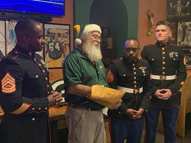Contributed photo / At the December Chattanooga Packer Backers club meeting when a check for Toys for Tots was presented, from left, are Gunnery Sgt. Steven McNeely; club President Dan Peterson (a U.S. Marine Corps veteran); Sgt. Austin Burwell; and Staff Sgt. Joshua Heuerman.