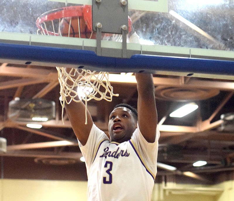 Staff Photo by Robin Rudd / Central's Ryan Montgomery finishes a dunk at the Best of Preps tournament in 2015.