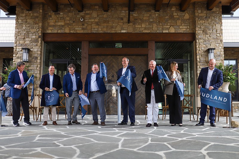 Staff photo by Olivia Ross / The ribbon is cut Thursday during the grand opening of the McLemore's Cloudland hotel.