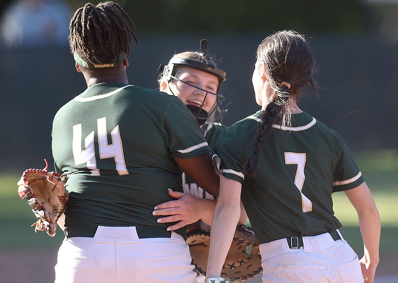 Staff photo by Matt Hamilton / Silverdale Baptist Academy softball players Amare Starling (44) and Emry Masterson (7) congratulate pitcher Ella Cunningham after the Lady Seahawks won 5-0 at Baylor on May 2, 2023. Silverdale and Baylor both won state championships last season.