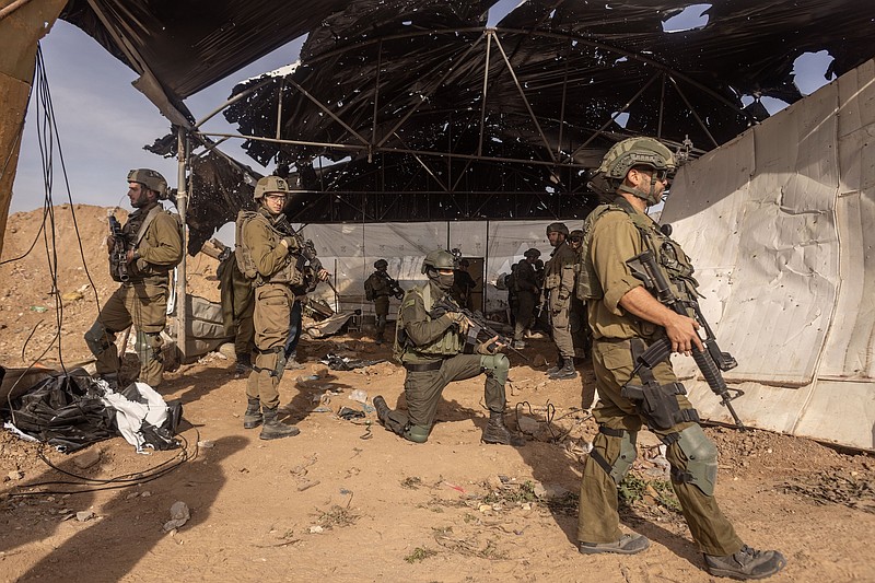 File photo/Avishag Shaar-Yashuv/The New York Times / Israeli soldiers guard the entrance to a tunnel used by Hamas during an escorted tour by the Israeli military for journalists in the central Gaza Strip, Jan. 8, 2024.