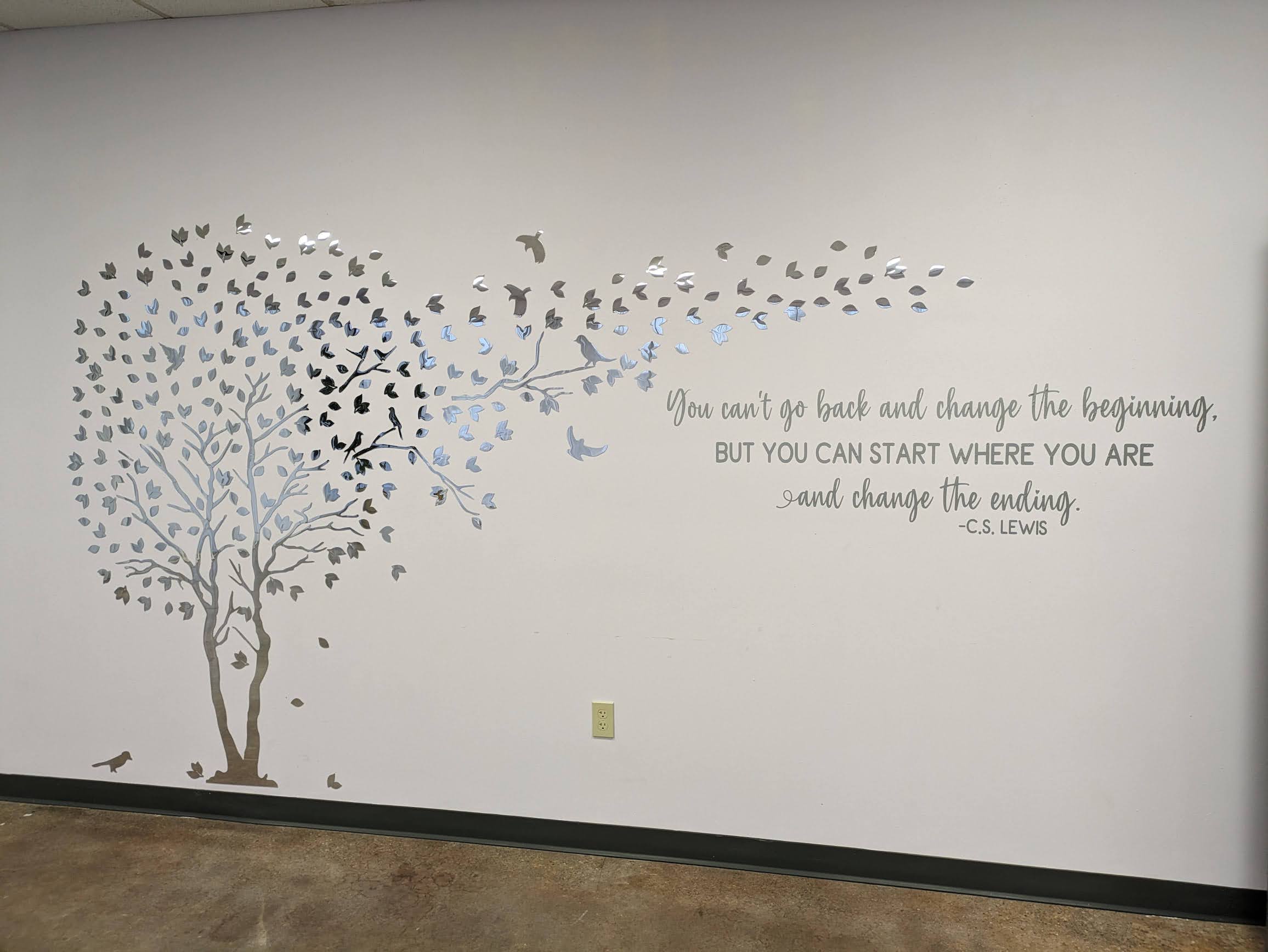 People Engaged in Recovery, a nonprofit in Mobile, Ala., provides recovery meetings, social events and connections to social services for more than 1,000 people a month. The wall decoration in the group's yoga room reminds people that change is possible. (Aneri Pattani/KFF Health News)