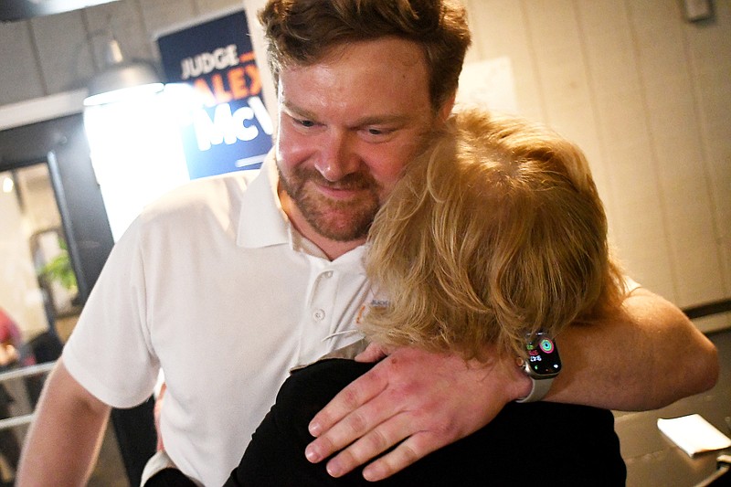 Staff Photo by Robin Rudd / Judge Alex McVeagh hugs his mother, Cindy McVeagh, after he declared victory in the Republican Primary for General Sessions Court Judge.  Judge Alex McVeagh held his election night party at the Lakeshore Grill in Hixson Tuesday.