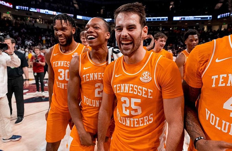 Tennessee Athletics photo / Tennessee's Josiah-Jordan James (30), Jordan Gainey (2) and Santiago Vescovi (25) are all smiles following Wednesday night's 66-59 win at South Carolina that clinched the SEC regular-season championship for the Volunteers.