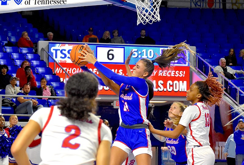 Staff photo by Patrick MacCoon / Cleveland junior Lauren Hurst, middle, comes up with a rebound in Friday's Class 4A state semifinal against Bartlett at Middle Tennessee State University.