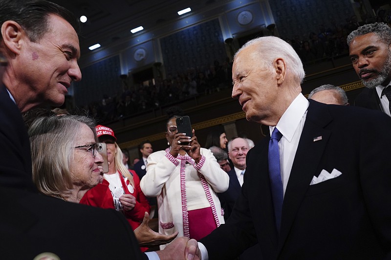Shawn Thew/Pool via AP / President Joe Biden, right, arrives to deliver the State of the Union address to a joint session of Congress at the Capitol, Thursday, March 7, 2024, in Washington, D.C.