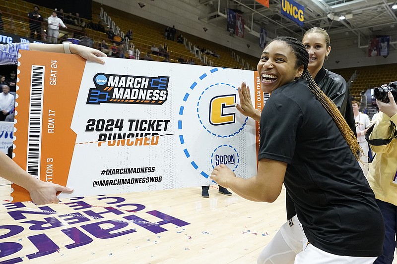 AP photo by Kathy Kmonicek / UTC senior guard Jada Guinn, the SoCon women's basketball tournament MVP, punches her team's ticket to the NCAA tourney after the Mocs beat UNC Greensboro 69-60 in the league title game Sunday afternoon at Harrah's Cherokee Center in Asheville, N.C. Guinn scored 32 points to lead the top-seeded Mocs past the second-seeded Spartans, clinching the SoCon's automatic bid for the NCAA's 68-team field.