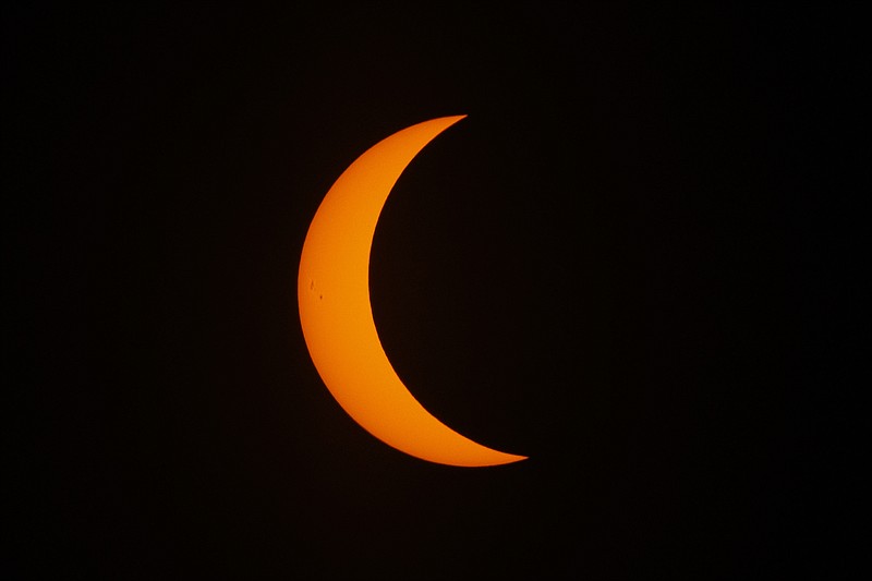 Staff Photo / A total solar eclipse is shown in progress on Aug. 21, 2017, in Spring City, Tenn. During a partial eclipse, the sun is partly covered by the moon's shadow, as seen here through a special filter, and is dangerous to view without protection. People people in Tennessee and much of the nation outside the path of totality will see a similar partial eclipse on April 8.