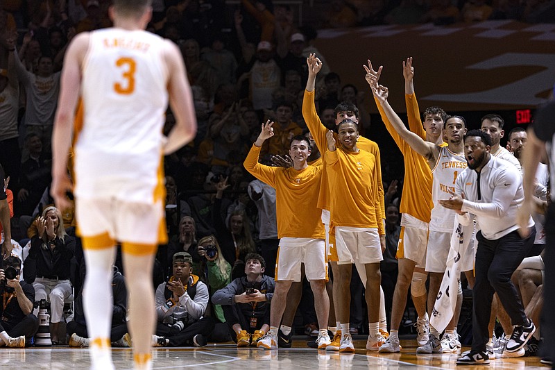 Tennessee players react after a three-point basket by guard Dalton Knecht (3) during the second half of an NCAA college basketball game against Kentucky, Saturday, March 9, 2024, in Knoxville, Tenn. (AP Photo/Wade Payne)