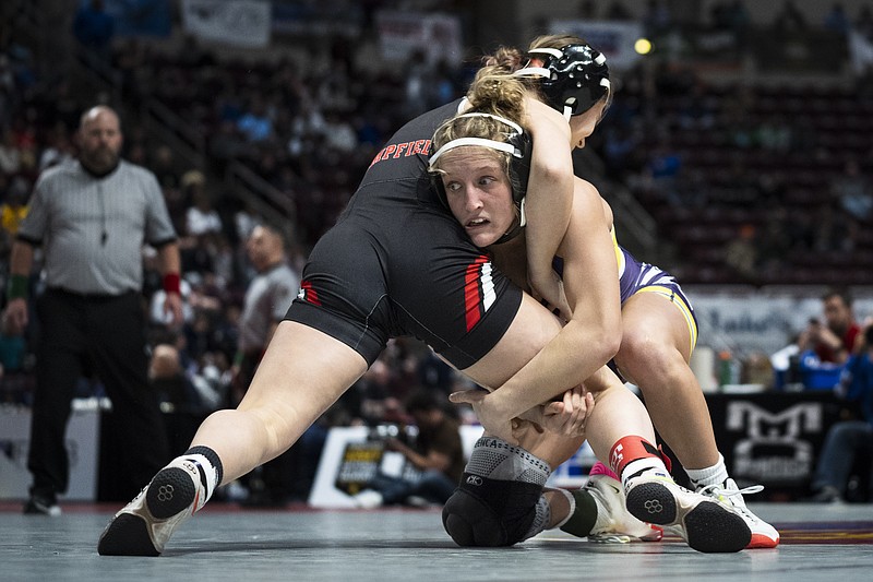 Palisades' Savannah Witt, right, wrestles Hempfield's Cleona O'Brien during the first found of the PIAA High School Wrestling Championships in Hershey, Pa., Thursday, March 7, 2024. Girls' wrestling has become the fastest-growing high school sport in the country. (AP Photo/Matt Rourke)