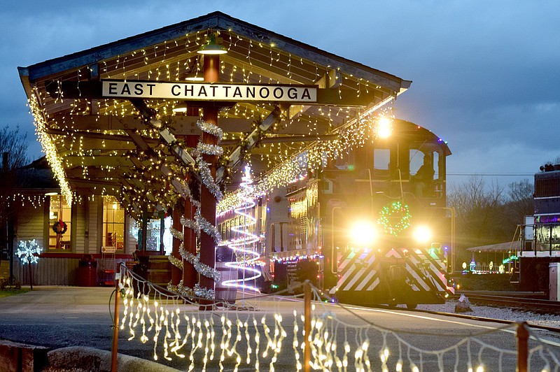 Staff File Photo By Robin Rudd / The Tennessee Valley Railroad Museum's Engine 606 brings its train of three Holiday Light passenger cars into the station on Dec. 28, 2021.