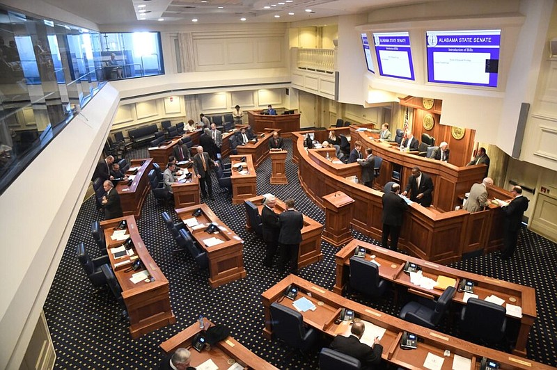 Senators work in the Alabama Senate chamber on Feb. 20 in Montgomery, Ala. After the Senate stripped a House gambling package, legislators aren't sure what's next for the legislature. / Alabama Reflector photo by Brian Lyman
