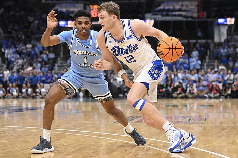 Associated Press / Joe Puetz
Drake's Tucker DeVries (12) drives against Indiana State's Julian Larry (1) during the second half of the championship game in the Missouri Valley Conference NCAA basketball tournament. DeVries is one of three Drake players with 60 or more 3-point makes this season.