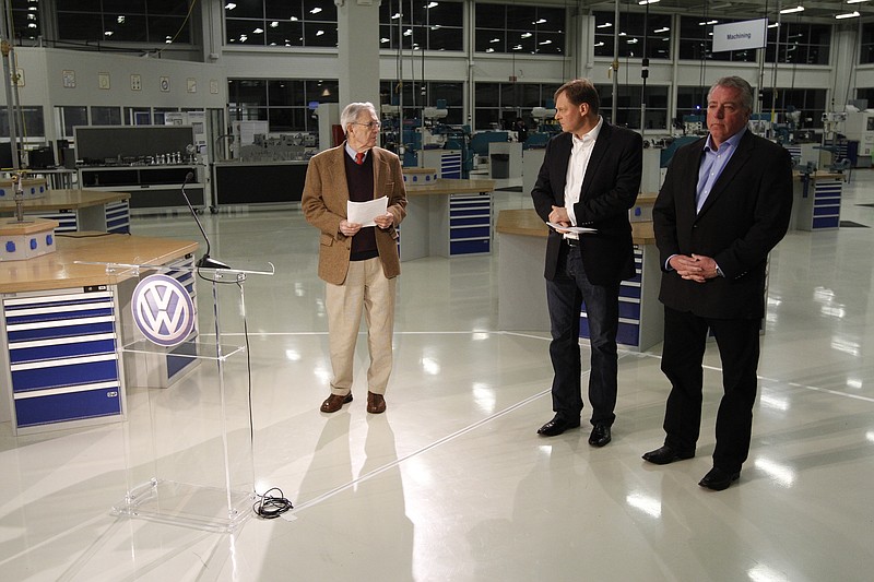 Staff File Photo / Retired Hamilton County Circuit Court Judge Sam Payne, left, prepares to announce in 2014 that Volkswagen employees voted to deny representation by the United Auto Workers. Looking on are Frank Fischer, center, then-CEO at the plant, and Gary Casteel, then-UAW Region 8 Director. The union has proposed three days in April for a new election.