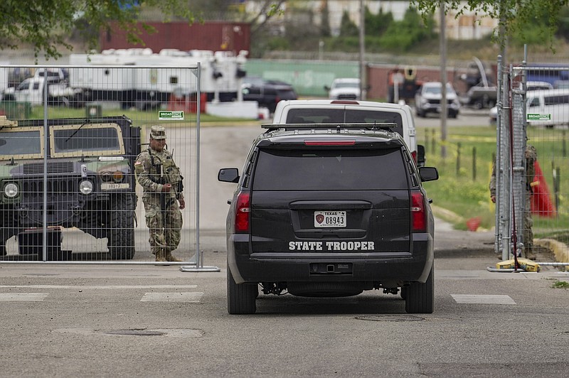 Photo/Raquel Natalicchio/Houston Chronicle via AP / National Guard and other law enforcement are stationed at a now closed-off Shelby Park on Wednesday, March 20, 2024, in Eagle Pass, Texas.