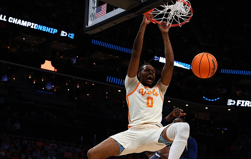 Tennessee Athletics photo / Jonas Aidoo finishes off a first-half dunk during Thursday night's dismantling of Saint Peter's in an NCAA tournament first-round matchup in Charlotte, N.C.