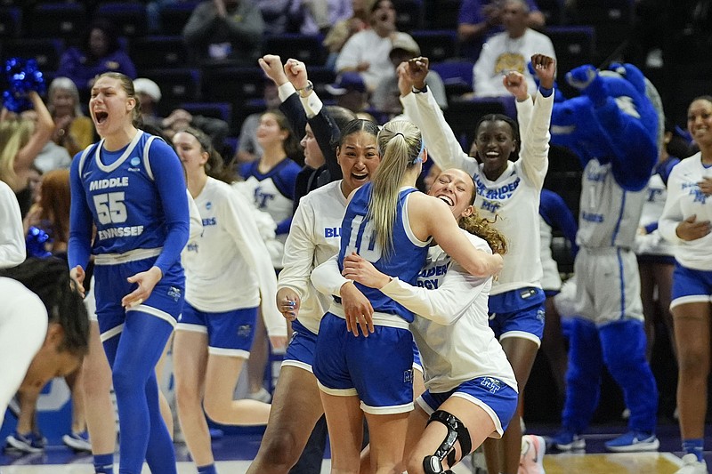 AP photo by Gerald Herbert / MTSU guard Jalynn Gregory (10) celebrates with teammates after the Lady Blue Raiders beat Louisville in the first round of the NCAA tournament Friday in Baton Rouge, La.