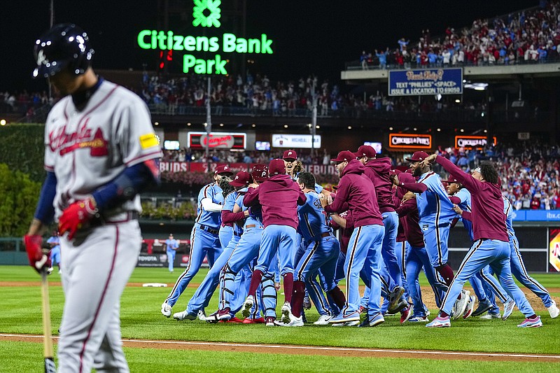 AP photo by Mat Rourke / The host Philadelphia Phillies celebrate after winning Game 4 of an NL Division Series against the Atlanta Braves at Citizens Bank Park on Oct. 12, 2023. Atlanta won the NL East Division title for the sixth straight time last season, but after finishing 14 games ahead of the Phillies for the second year in a row, the Braves were also eliminated by Philadelphia in the divisional round for the second consecutive postseason.
