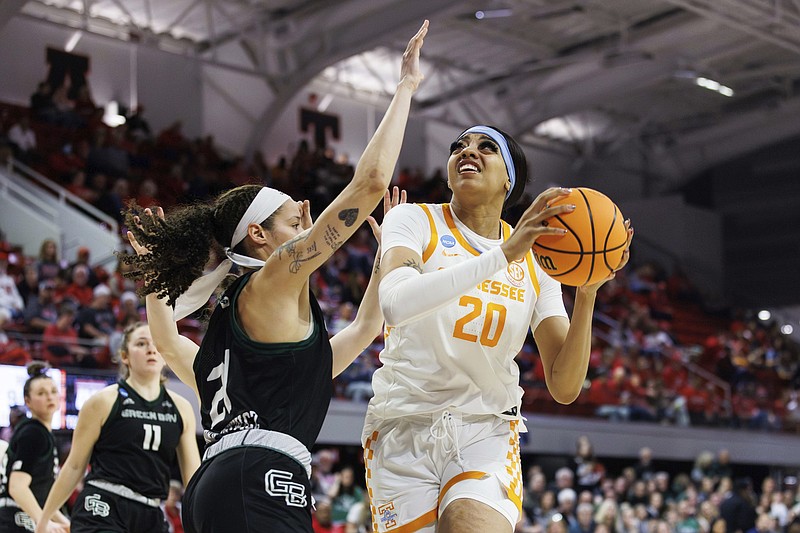 AP photo by Ben McKeown / Tennessee's Tamari Key drives as Green Bay's Jasmine Kondrakiewicz defends during an NCAA tournament first-round game Saturday in Raleigh, N.C.