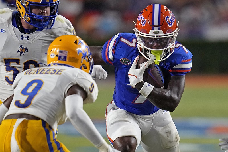 AP photo by John Raoux / Florida running back Trevor Etienne carries the ball during a home game against McNeese last Sept. 9 in Gainesville. Etienne transferred to Georgia after the season and is the projected starting running back for the Bulldogs next season.