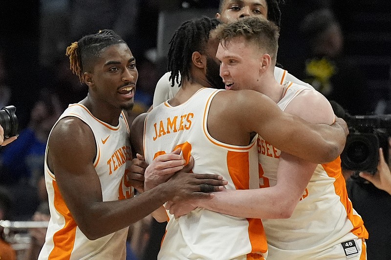 Tennessee guard Dalton Knecht hugs guard Josiah-Jordan James after their win against Texas in a second-round college basketball game in the NCAA Tournament, Saturday, March 23, 2024, in Charlotte, N.C. (AP Photo/Chris Carlson)