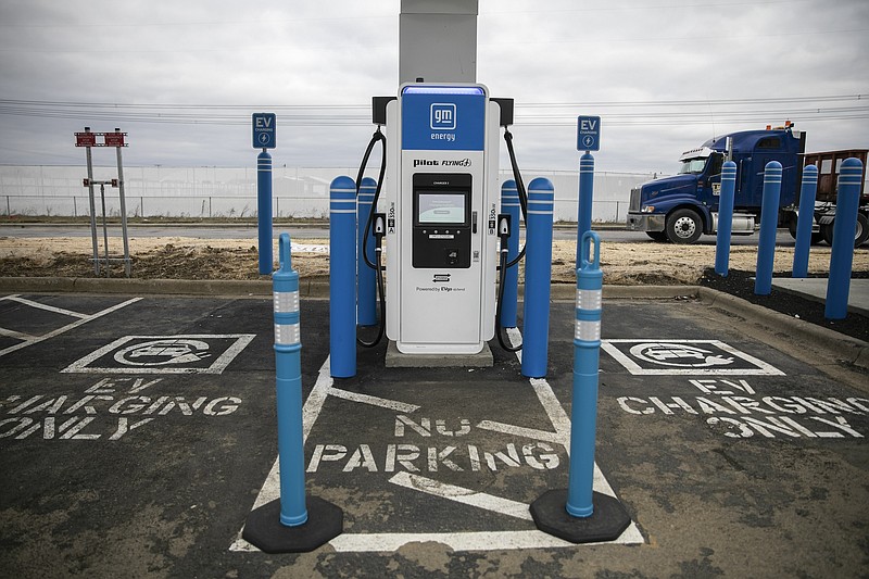 Photo/Maddie McGarvey/The New York Times / An electric vehicle charging station is shown in London, Ohio, on Dec. 11, 2023. President Biden's new rule cutting emissions from vehicle tailpipes has deepened a partisan battle over automotive technology.
