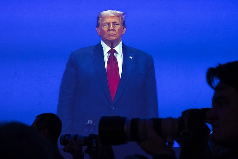 Photo/Haiyun Jiang/The New York Times / Former President Donald Trump is visible on a video screen as he appears onstage during the Conservative Political Action Conference in National Harbor, Md., on Feb. 24, 2024.