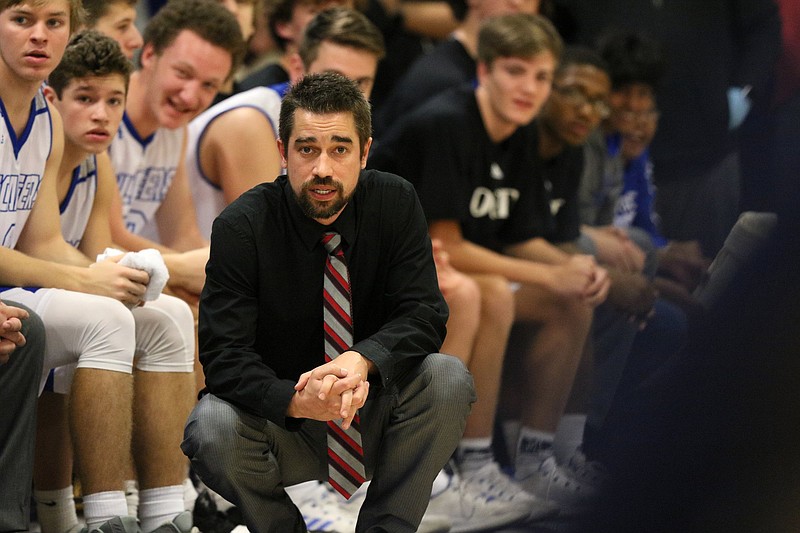Staff photo / Josh Templeton watches from in front of the bench while coaching the Boyd Buchanan boys' basketball team during a game against Chattanooga Christian in January 2019.